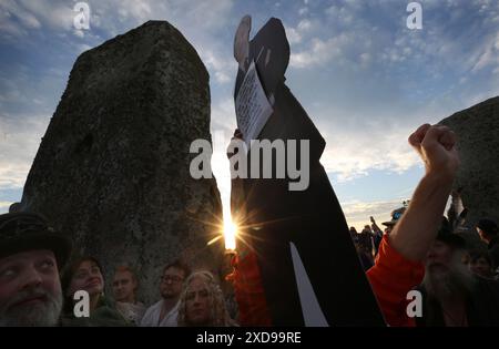 June 20, 2024, Salisbury, England, UK: A full size model of Julian Assange and its owner join the celebrations after Mr Assange was positively name-checked during a druid ceremony as part of the Summer Solstice celebrations during sundown at Stonehenge. Stonehenge was built by early Britons some 4000 years ago to align with the sun on the solstices. The summer solstice marks the end of Spring and the start of Summer and is the longest day and the shortest night in the Northern Hemisphere. The event is celebrated by thousands of pagans worldwide with singing and dancing. (Credit Image: © Martin Stock Photo