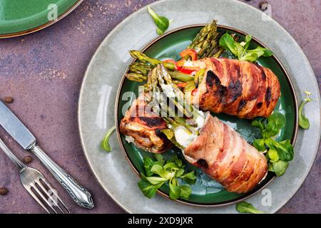 Baked meat rolls or beef roulade stuffed with asparagus. Food for Christmas dinner. Top view. Stock Photo