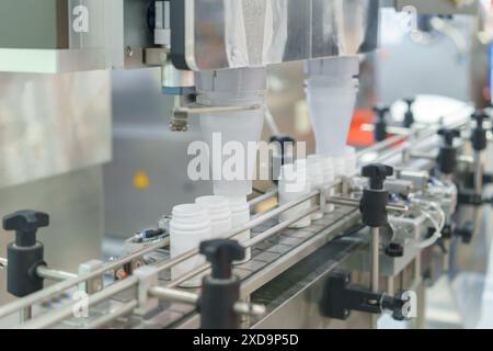 crucial part of automated production lines in various industries consistent filling of bottles Stock Photo