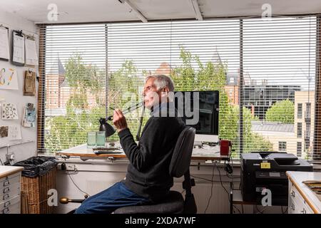 Artist David Gentleman in his studio, Camden, London, UK Stock Photo