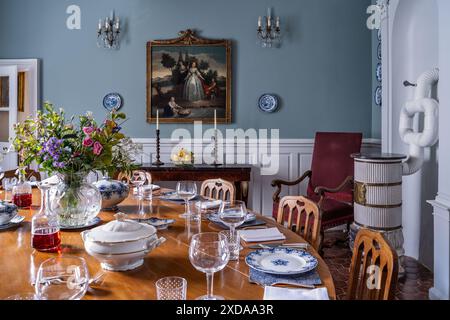 Dining room with set table in renovated stone-built hotel particulier dating from 1770 in Saulieu, Burgundy, France. Stock Photo