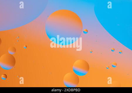Abstract image with smooth transitions of orange and blue colors, creating vibrant and dynamic fluid pattern Stock Photo