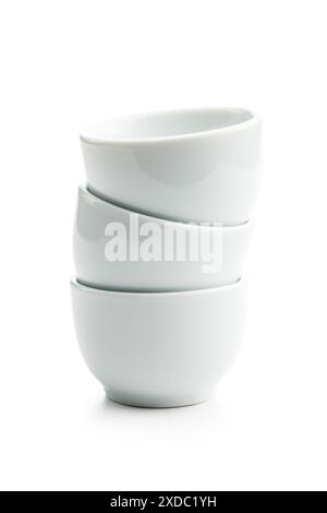 Stack of three White Ceramic Bowls isolated on a White Background Stock Photo