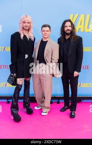 Berlin, Germany. 21st June, 2024. The twin brothers Bill (vocals, l) and Tom Kaulitz (guitar, r), as well as Georg Listing (bass, M) from the band Tokio Hotel stand on the red carpet for the Netflix documentary series 'Kaulitz & Kaulitz' on the occasion of the special screening at the Delphi-Filmpalast. The reality series gives an insight into the lives of twins Tom and Bill Kaulitz in Los Angeles and Germany. Credit: Christoph Soeder/dpa/Alamy Live News Stock Photo