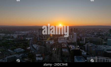 A breathtaking capture of the sunset over Manchester's skyline, showcasing landmarks such as The Great Jackson Street skyscraper district Stock Photo