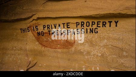 “NO TRESSPASSING” Ancient pictograph, a tribute to a mature elk, was defaced by a rancher warning away visitors from his property in the early 1900’s. Stock Photo