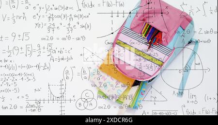 Image of mathematical equations floating over school bag on white surface Stock Photo