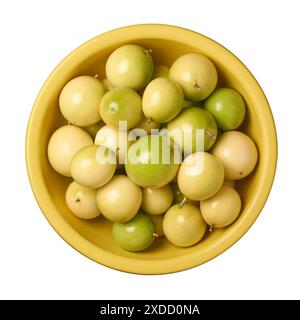 ripe yellow passion fruits in basket isolated white background, round oval tropical fruits delicious and nutritious, taken straight from above Stock Photo