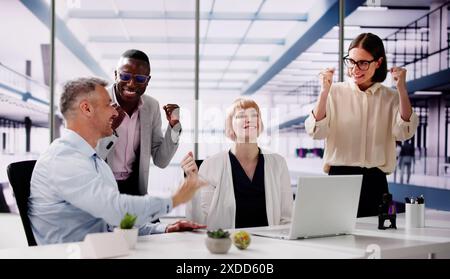 Workers At Workplace High Five. Office Collaboration And Group Spirit Stock Photo