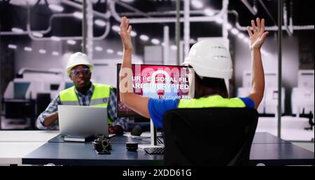 Shocked Engineer In Automated Semiconductor Factory During Ransomware Attack Stock Photo