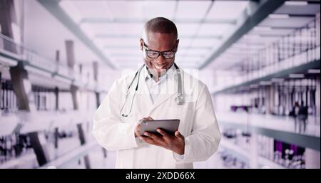 Virtual health consultations with a smiling African American doctor using a tablet in a digital workplace. Healthcare professional in action. Stock Photo