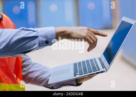 Closeup engineer male hand pointing at laptop screen Stock Photo