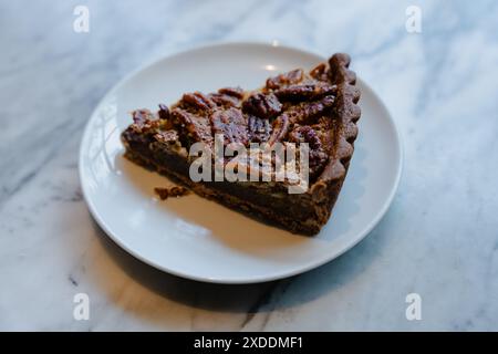 Slice of Pecan Pie on White Plate Stock Photo