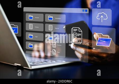 African American businessman utilizing efficient data management system to organize and secure files for corporate office collaboration. Stock Photo