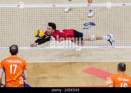 Pasay City, Philippines. 22nd June, 2024. Justin Lui (top) of Canada saves the ball during the match between Canada and the Netherlands at the Men's Volleyball Nations League (VNL) 2024 in Pasay City, the Philippines, on June 22, 2024. Credit: Rouelle Umali/Xinhua/Alamy Live News Stock Photo