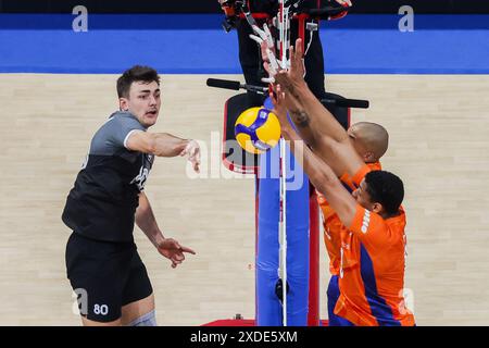 Pasay City, Philippines. 22nd June, 2024. Eric Loeppky (L) of Canada spikes the ball during the match between Canada and the Netherlands at the Men's Volleyball Nations League (VNL) 2024 in Pasay City, the Philippines, on June 22, 2024. Credit: Rouelle Umali/Xinhua/Alamy Live News Stock Photo