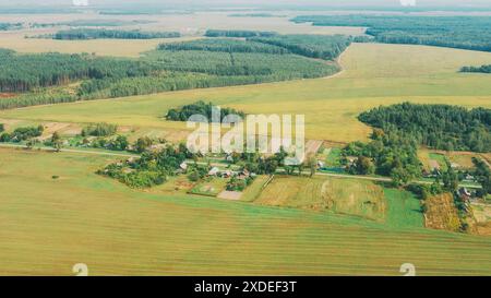 Vasilyovka, Dobrush District, Gomel Region, Belarus. Aerial View Of Small Village With Wooden Houses At Spring Day. Beautiful Rural Landscape In Bird Stock Photo