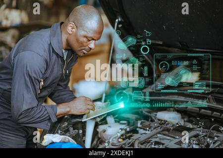 Engineer Mechanic using Advance technology software application check tuning engine car ECU concept. Stock Photo
