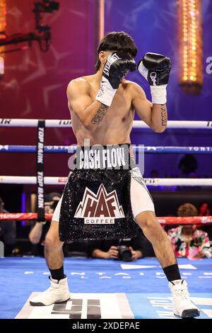 June 21, 2024: Top Rank Ring Girl Stephanie Ann Cook holds the NABO ...