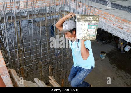 Mexican construction workers cement pouring concrete Stock Photo