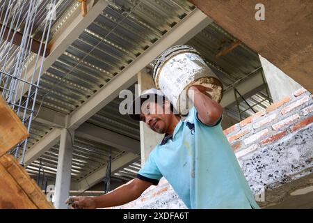 Mexican construction workers cement pouring concrete Stock Photo