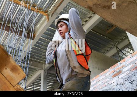 Mexican construction workers cement pouring concrete Stock Photo