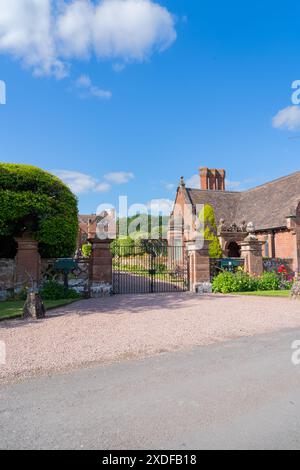 View of an English stately home with lodge, Attractive English Mansion House in portrait orientation Stock Photo