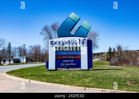 List of attractions sign at Magnetic Hill in Moncton, New Brunswick, Canada Stock Photo