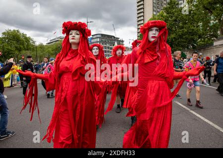 London, UK. 22nd June, 2024. Different Environmental groups come together for the Restore Nature Now march and rally. The Red Brigade march along Park Lane. Credit: James Willoughby/Alamy Live News Stock Photo