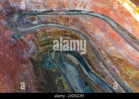 Aerial view of roads winding down into a deep mining pit at Cobar in Outback New South Wales, Australia Stock Photo