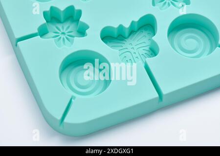 Fragment silicone lollipop mold on a white background, close up Stock Photo