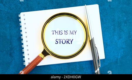 My story symbol. Words THIS IS MY STORY through a magnifying glass on a piece of notepad Stock Photo