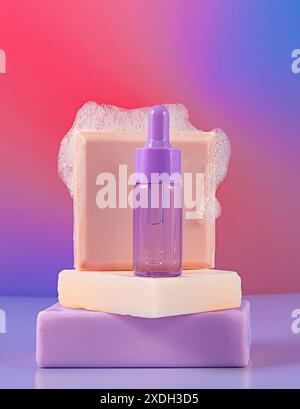 Purple dropper bottle on stacked pastel soaps with bubbles, vibrant gradient background Stock Photo