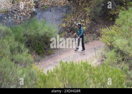 A member of the Guardia Civil near the last known location of Jay Slater, near to the village of Masca, Tenerife, where the search for missing British teenager Jay Slater, 19, from Oswaldtwistle, Lancashire, continues. Picture date: Sunday June 23, 2024. Stock Photo
