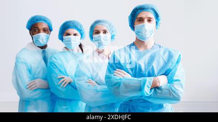 Surgeons Team Ready for Surgery. Practitioners Wearing Protective Uniforms Stock Photo