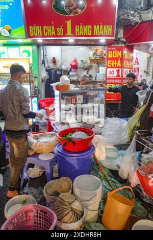 Hanoi, Vietnam - 9 Feb, 2024: A busy Bun Cha restaurant on the streets of Hanoi, Vietnam Stock Photo