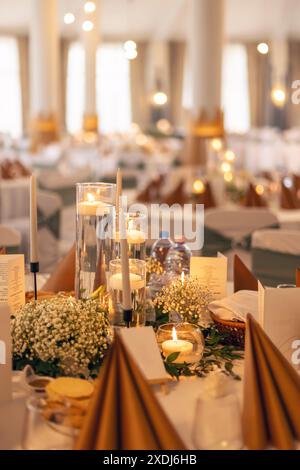 Elegant wedding reception table setting with candlelight Stock Photo