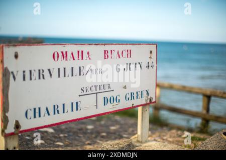 A vintage sign at Omaha Beach in Normandy, France, highlighting its historical significance from June 6, 1944. Stock Photo