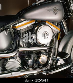 Vintage Harley-Davidson motorcycle detail showing early motorized bicycle engine, frame, fuel tank logo and mechanical components on a classic design. Stock Photo
