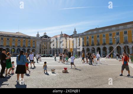 Playing with soap bubbles in Terreiro do Paço, Lisbon, Portugal Stock Photo