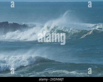 Large waves crashing over rocks on an island, big surf, salt water, Mid North coast NSW Australia Stock Photo