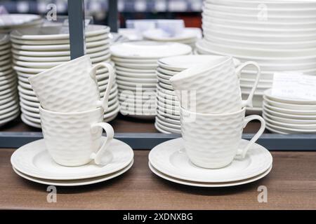 White tea set on the counter in a supermarket. Fashion and aesthetics Stock Photo