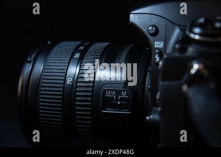 Black Digital Camera Lens and DSLR Camera Close Up On Dark Background Stock Photo