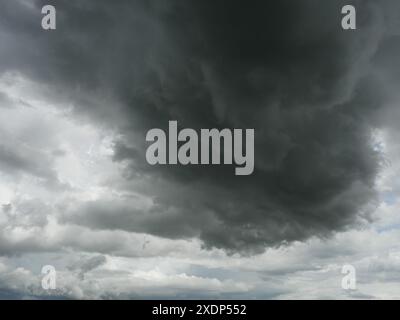 Cumulonimbus cloud formations on tropical sky , Nimbus moving , Abstract background from natural phenomenon and gray clouds hunk , Thailand Stock Photo