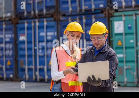 Engineer People work in Port Cargo Container Shipping Yard using Laptop Operate with Customs Team Helping Together. Stock Photo