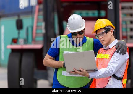 Engineer People work in Port Cargo Container Shipping Yard using Laptop Operate with Customs Team Helping Together. Stock Photo