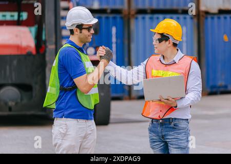 Group of Port Container Ship Yard Colleague Workers working together join teamwork control operate solving problem. Stock Photo