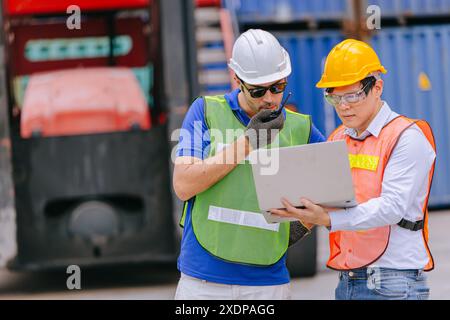 Group of Port Container Ship Yard Colleague Workers working together join teamwork control operate solving problem. Stock Photo