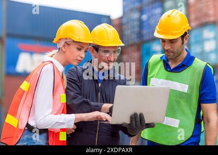 Group of Port Container Ship Yard Colleague Workers working together join teamwork control operate solving problem. Stock Photo
