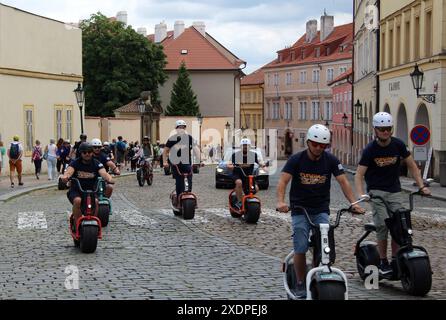 Tourists with fat-tire electric scooters in the city center of Prague, Czech Republic, June 22, 2024. (CTK Photo/Milos Ruml) Stock Photo